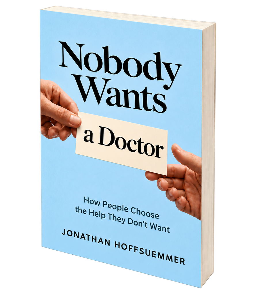 Paperback of Nobody Wants a Doctor: two hands passing a card that reads a Doctor